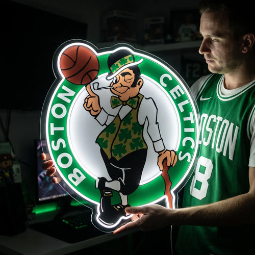 Boston Celtics LED neon sign - A man in a green Celtics jersey holds a large green and white Boston Celtics leprechaun logo neon sign.