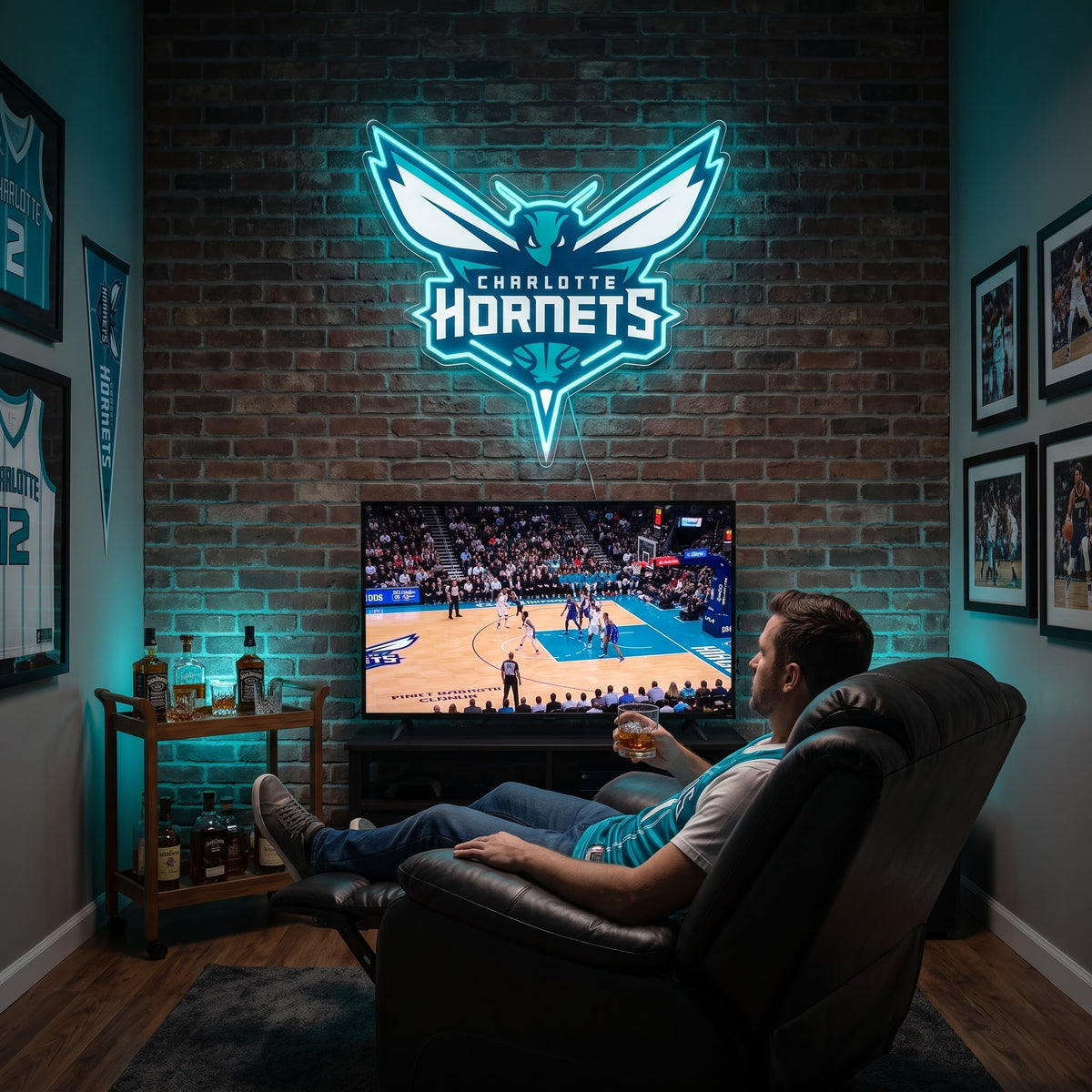 Charlotte Hornets LED neon sign above a TV in a man cave with framed jerseys, as a fan watches basketball from a recliner
