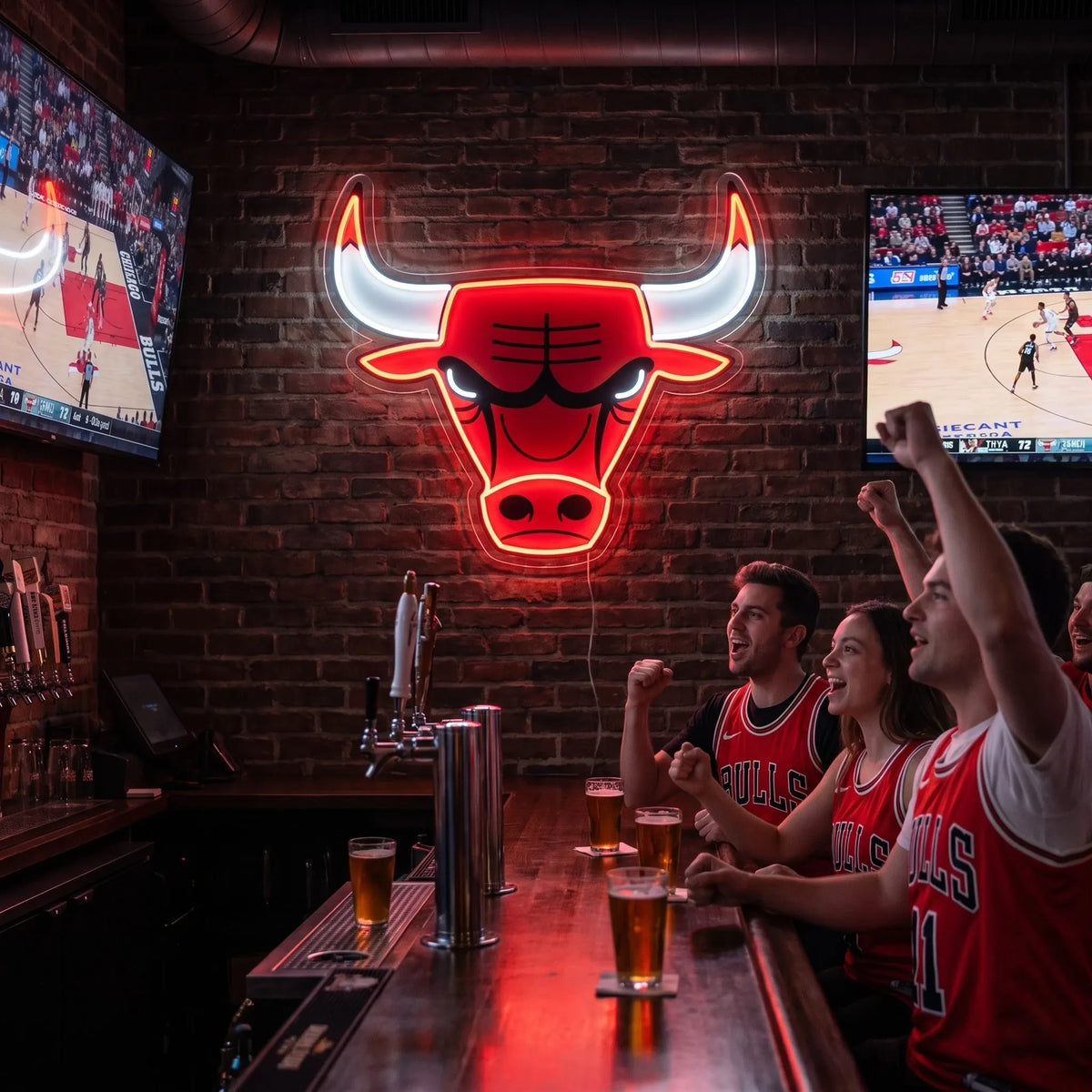 Chicago Bulls LED neon sign - Fans in Bulls jerseys cheer with beers at a sports bar under a red Chicago Bulls logo neon sign on a brick wall.
