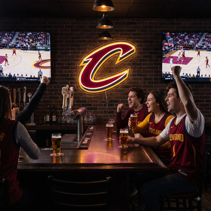Cleveland Cavaliers LED neon sign - Friends in Cavaliers jerseys cheer at a sports bar under a Cleveland Cavaliers C logo neon sign between two TVs.