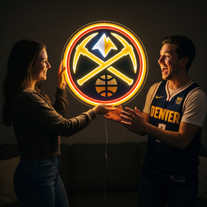 Woman surprising a basketball fan with a glowing Denver Nuggets LED neon sign gift