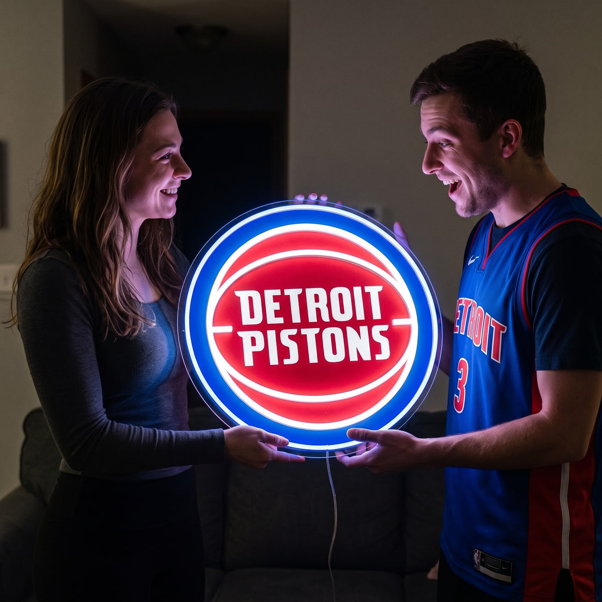 Woman surprising a basketball fan with a glowing Detroit Pistons LED neon sign gift