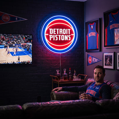 Detroit Pistons LED neon sign glowing above the TV in a basketball man cave