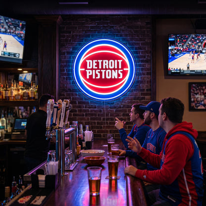 Detroit Pistons LED neon sign on a brick wall in a sports bar with fans watching the game