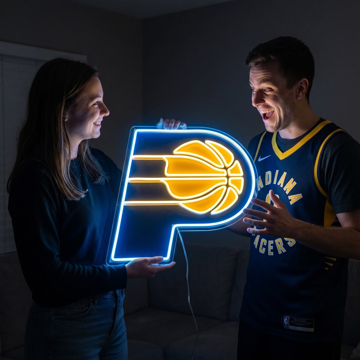 Woman surprising a basketball fan with a glowing Indiana Pacers LED neon sign gift
