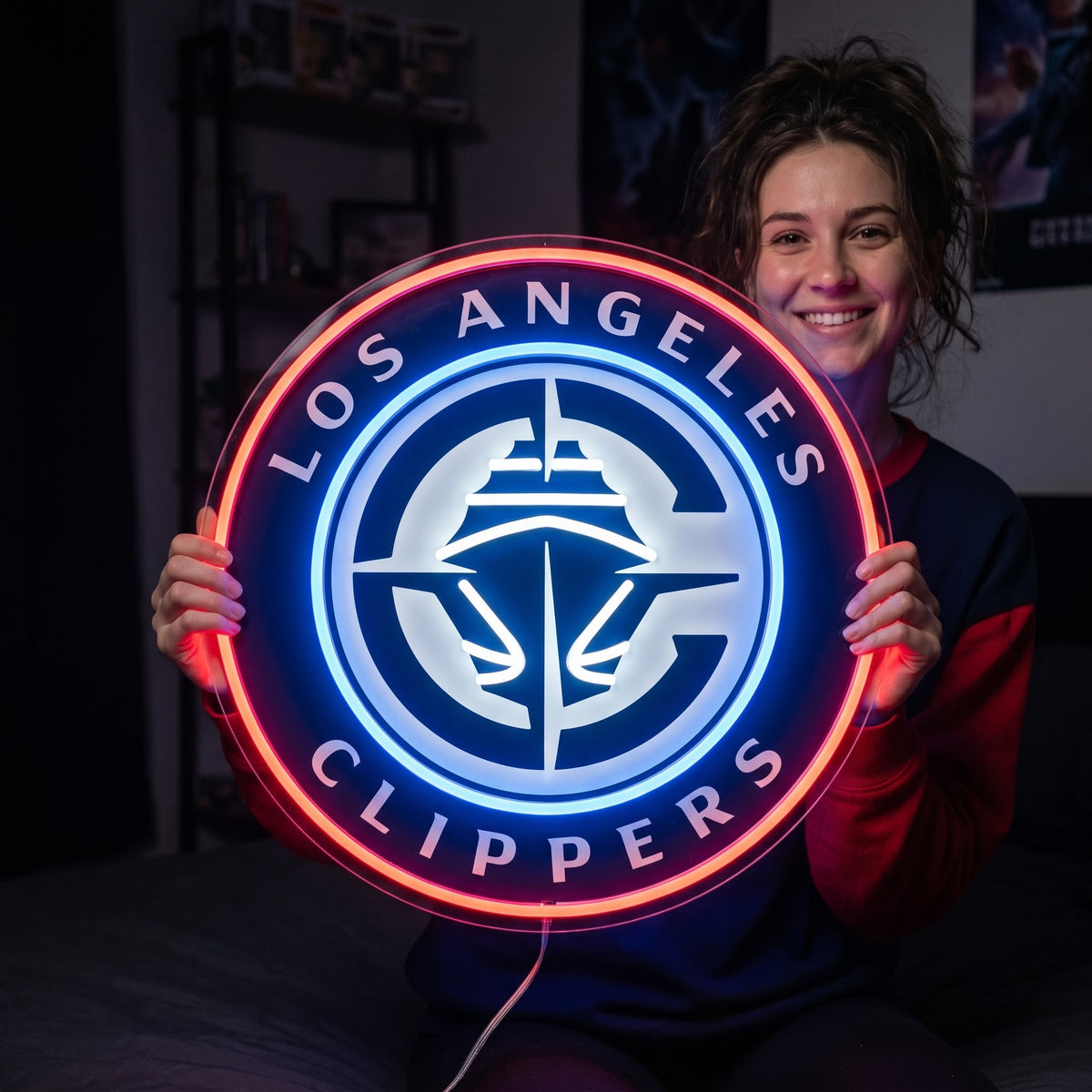 Woman holding a glowing Los Angeles Clippers LED neon sign