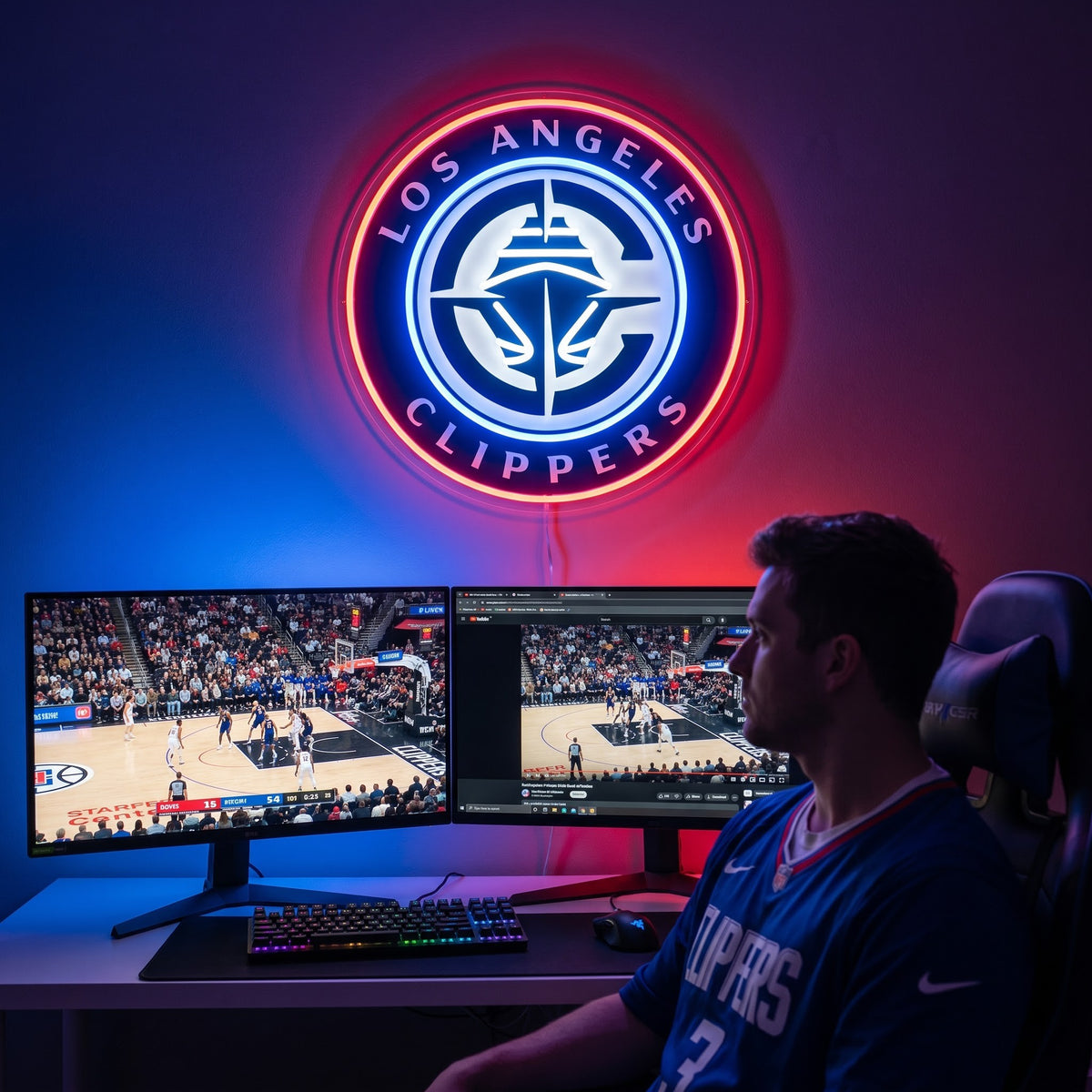 Los Angeles Clippers LED neon sign above a gaming setup with a fan watching basketball