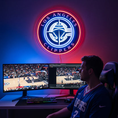 Los Angeles Clippers LED neon sign above a gaming setup with a fan watching basketball