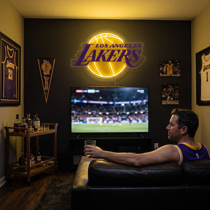Los Angeles Lakers LED neon sign glowing above the TV in a basketball man cave