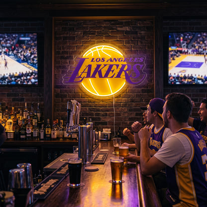 Los Angeles Lakers LED neon sign on a brick wall in a sports bar with fans watching the game