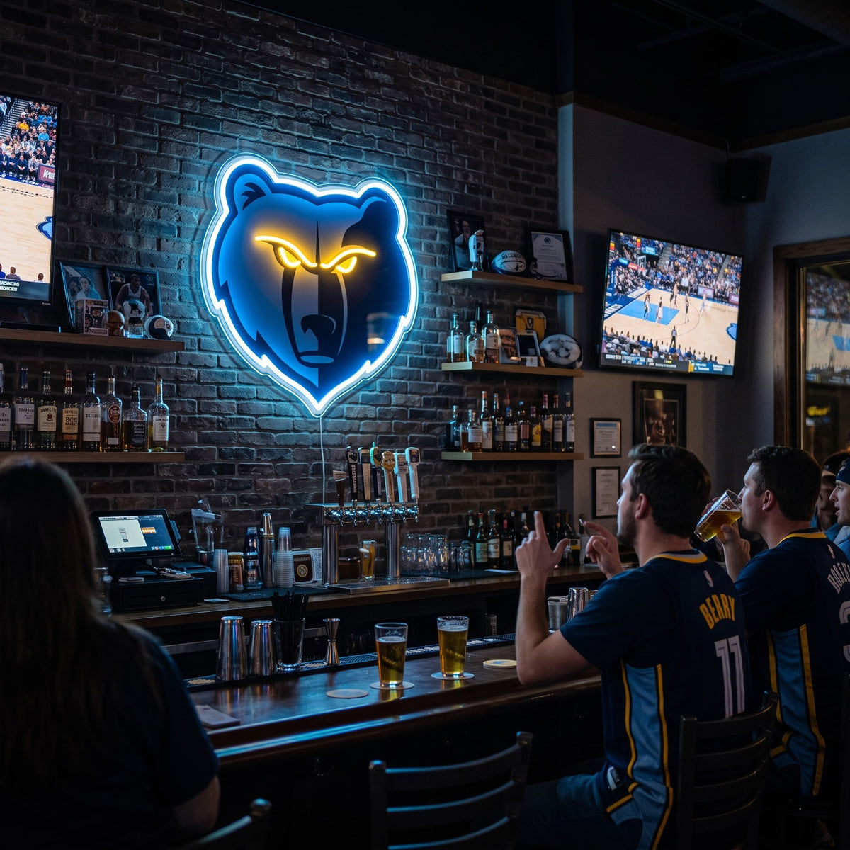 Memphis Grizzlies LED neon sign on a brick wall in a sports bar with fans watching the game