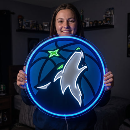 Woman holding a glowing Minnesota Timberwolves LED neon sign