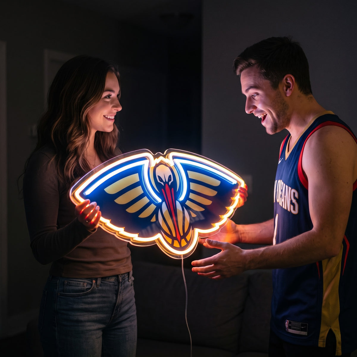 Woman surprising a basketball fan with a glowing New Orleans Pelicans LED neon sign gift