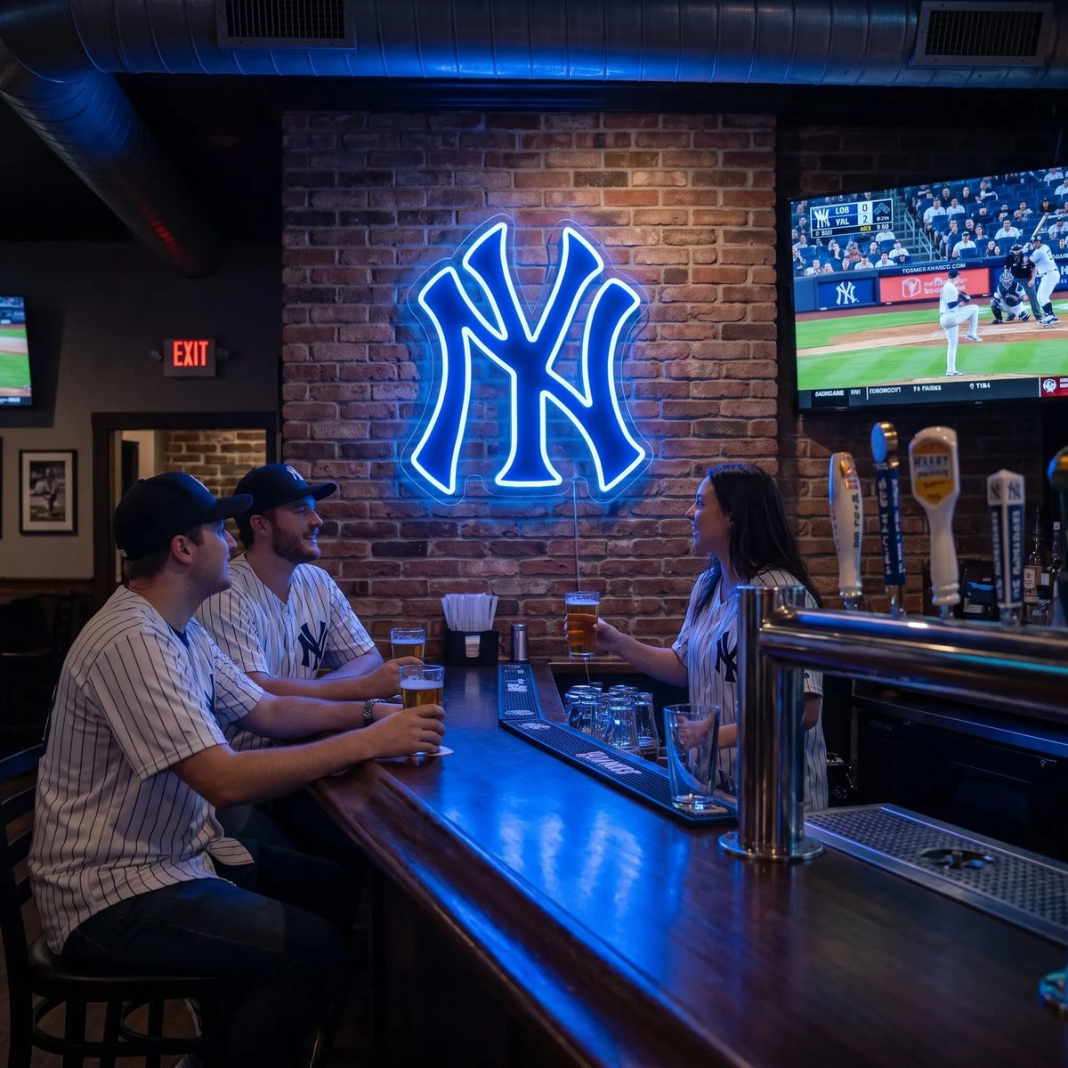 New York Yankees LED neon sign - Fans in Yankees jerseys enjoy beers at a sports bar under a blue NY Yankees logo neon sign on a brick wall.