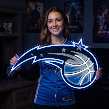Woman holding a glowing Orlando Magic LED neon sign