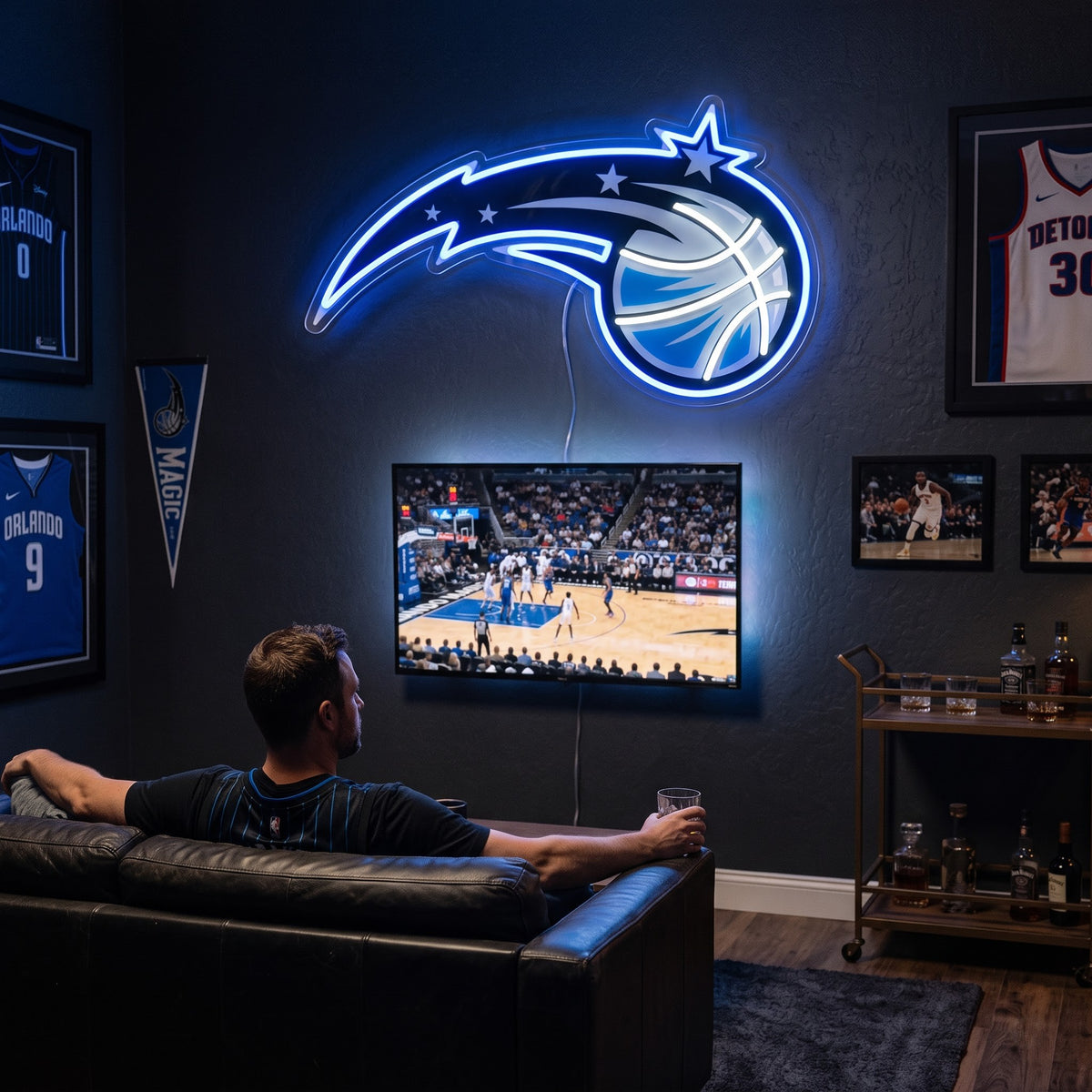 Orlando Magic LED neon sign glowing above the TV in a basketball man cave