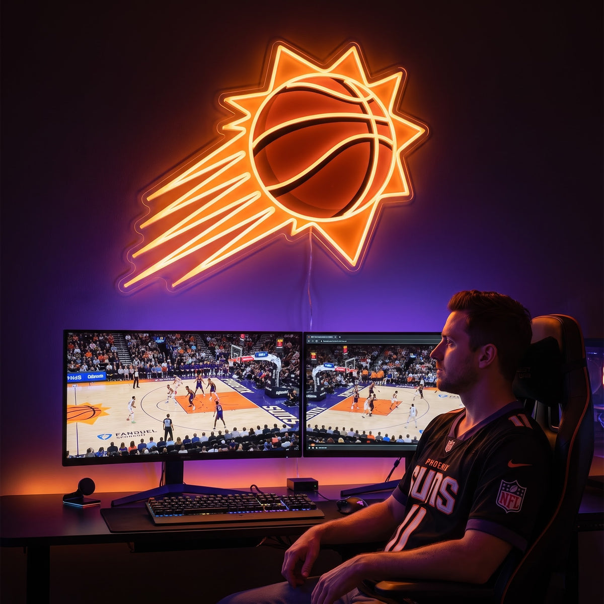 Phoenix Suns LED neon sign above a gaming setup with a fan watching basketball