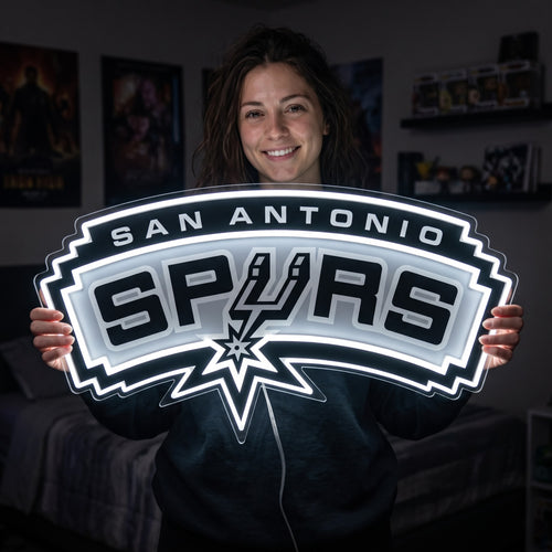 Woman holding a glowing San Antonio Spurs LED neon sign
