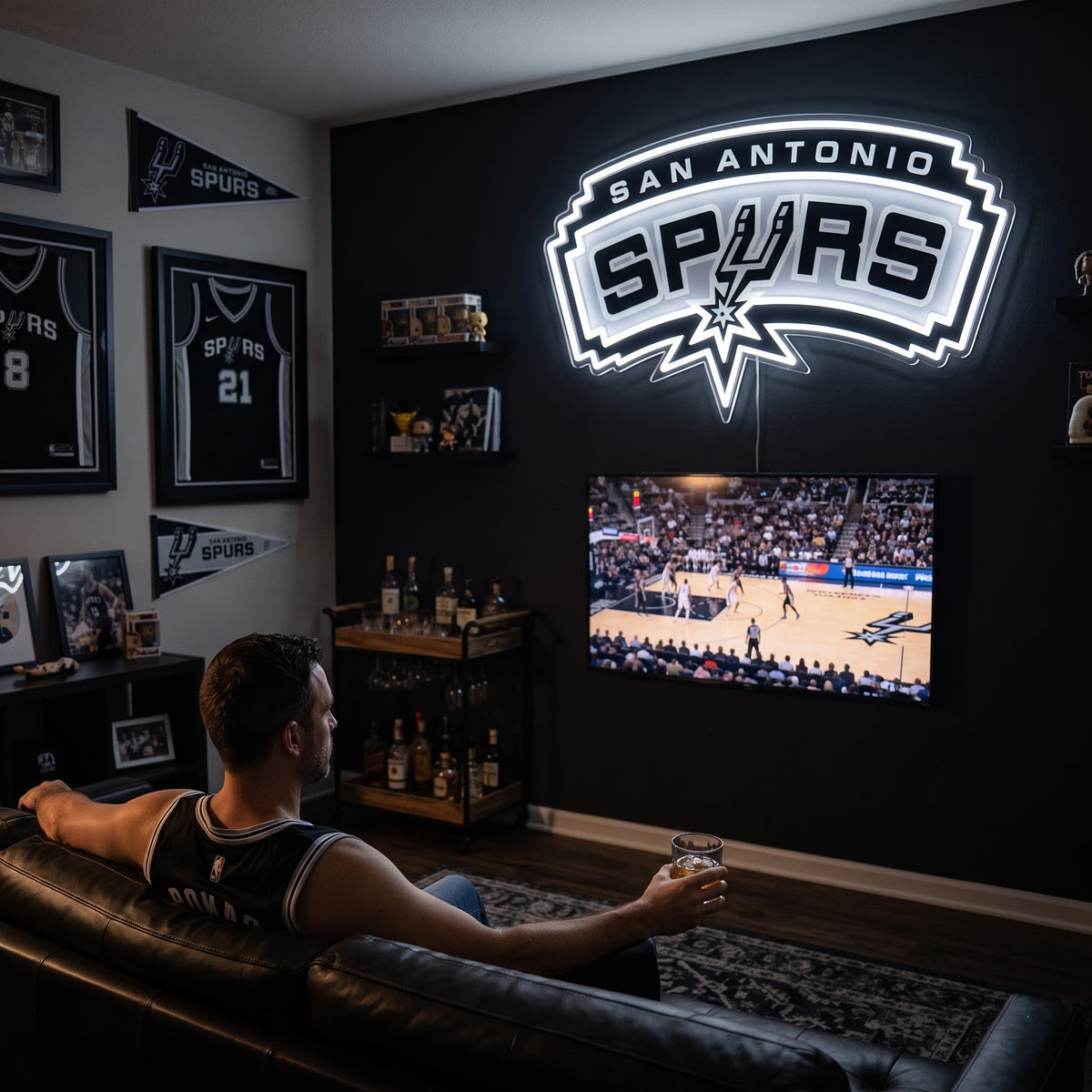 San Antonio Spurs LED neon sign glowing above the TV in a basketball man cave