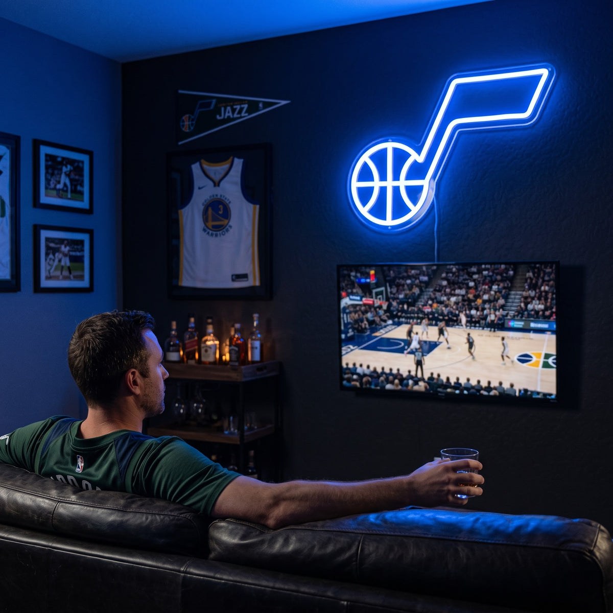 Utah Jazz LED neon sign glowing above the TV in a basketball man cave